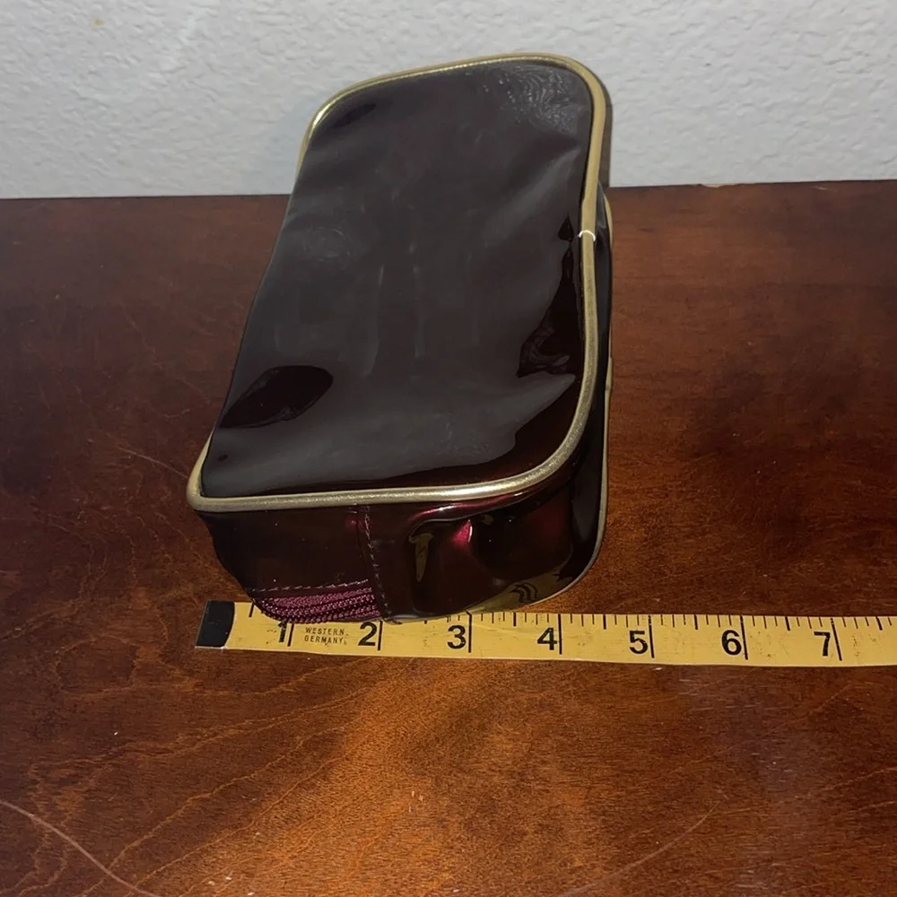 Avon Irridescent Burgundy PVC Make Up Bag Wristlet Gold Trim 2003 NOS